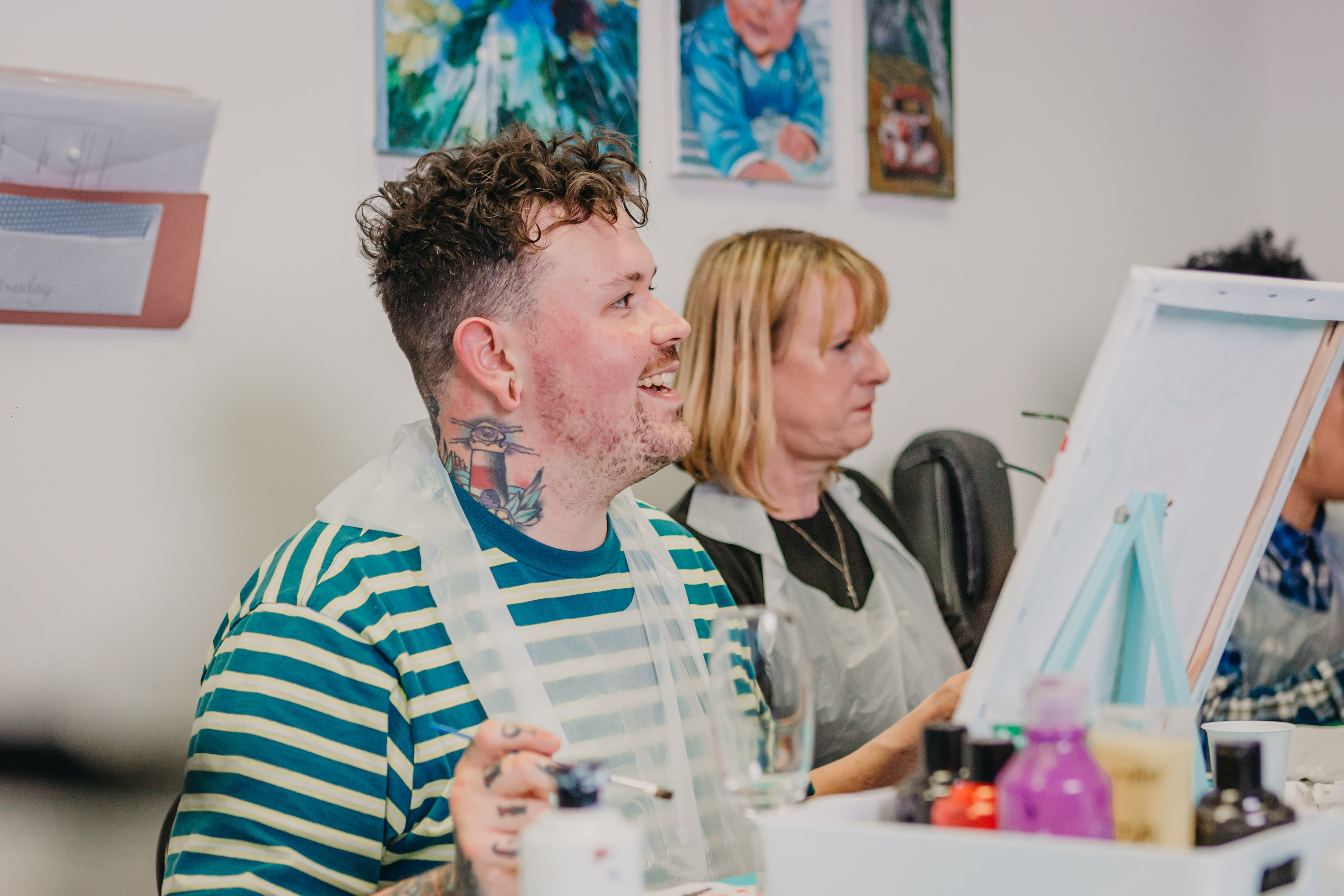 A mother and son at a painting class